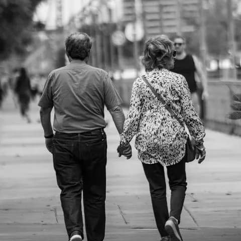 an older couple walking together