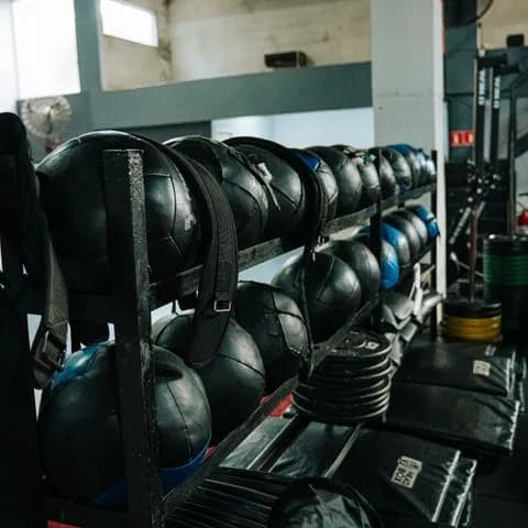 a rack of weighted bags in a gym