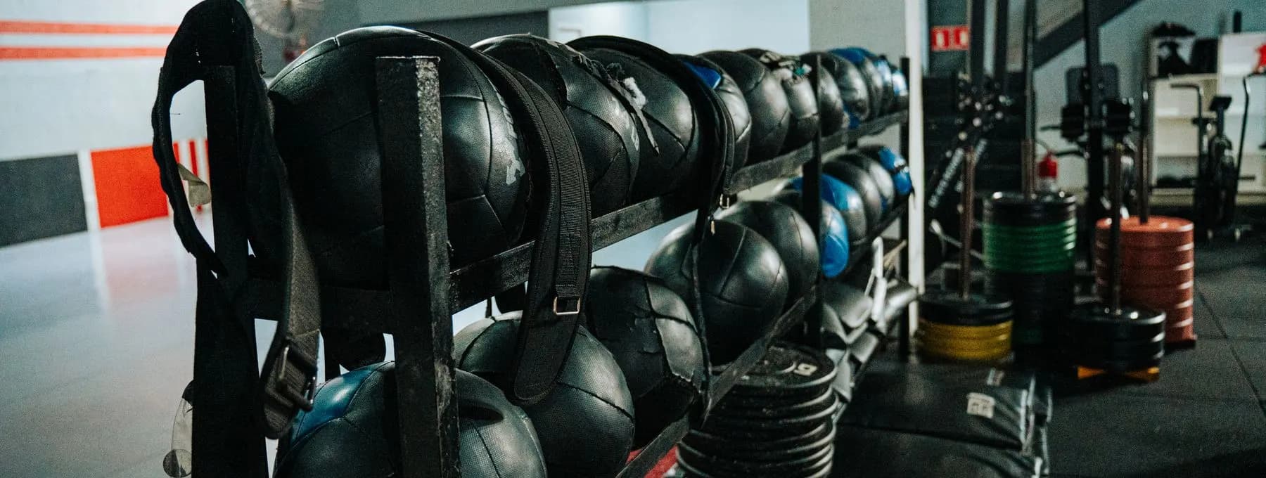 a rack of weighted bags in a gym