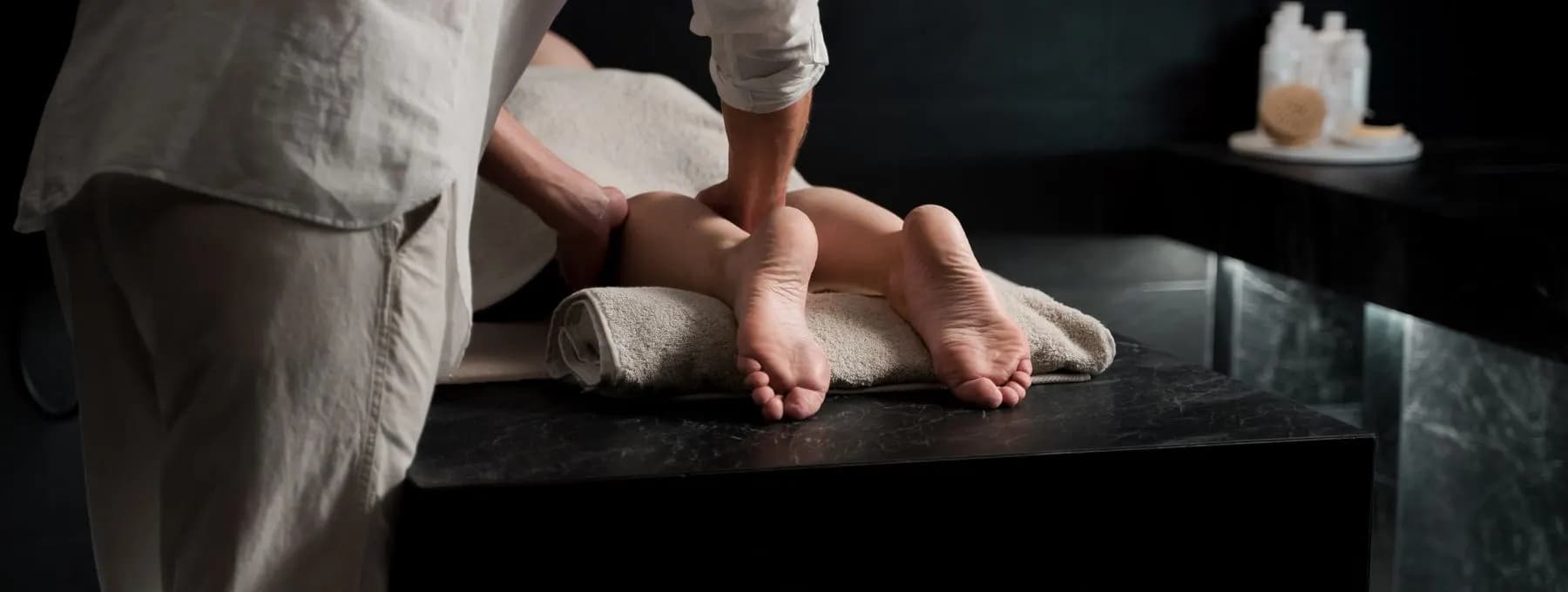 a therapist working on someone's foot